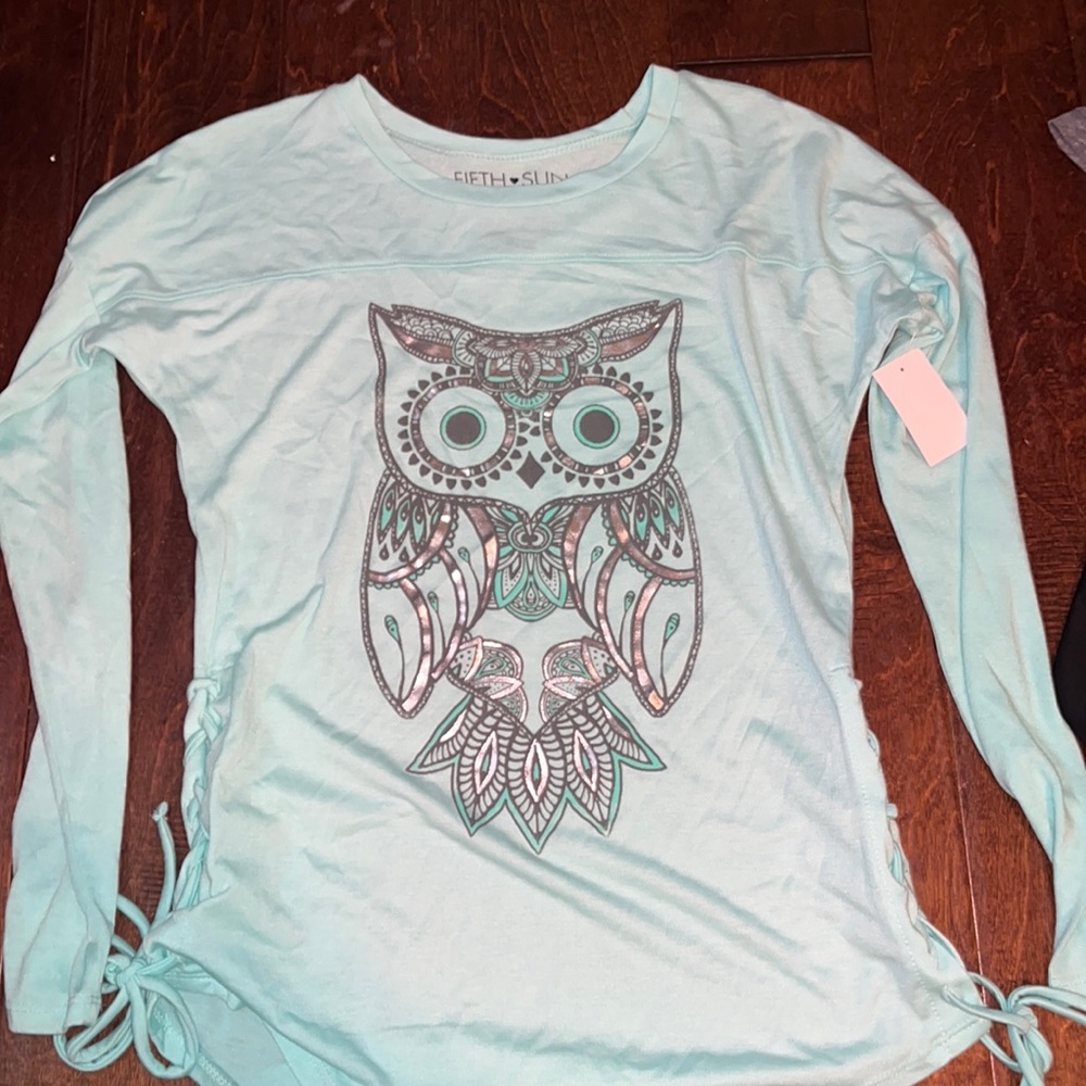 Blue long sleeve shirt with a owl on the front